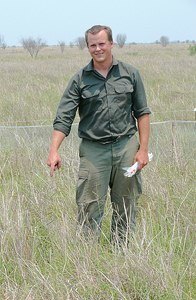 STCP Research Fellow Aaron Pratt points out an Attwater’s prairie- chicken nest in the midst of a protective wire enclosure.